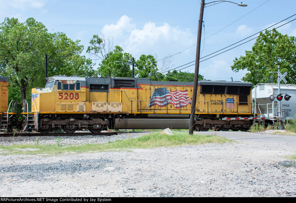 UP 5208 trails on a manifest at Tower 26